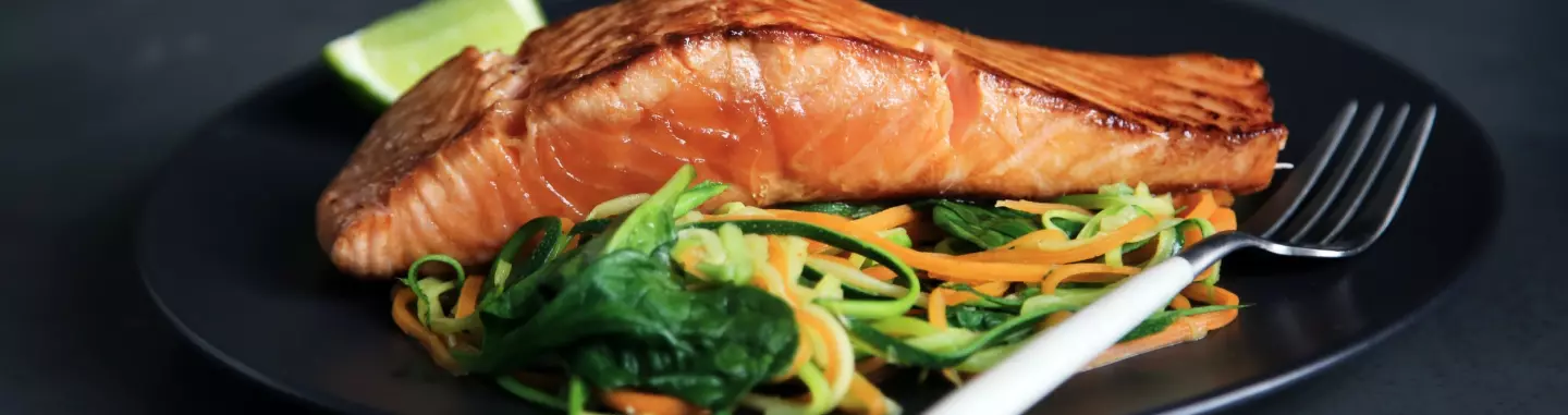 An example of world's cuisine representative - grilled salmon on a bed of vegetables