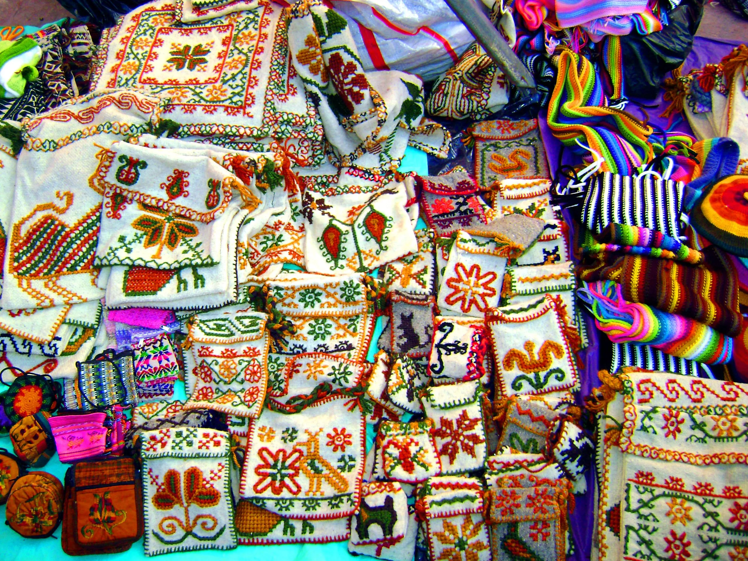 Tourist shopping for handicrafts - knitted scarves, bags and towels